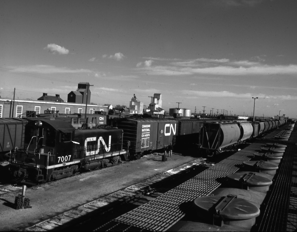 Photo: Freight train transporting potash in yard, Melville, Saskatchewan, 1967. Photographer: G. Richard. CSTM/CN000543